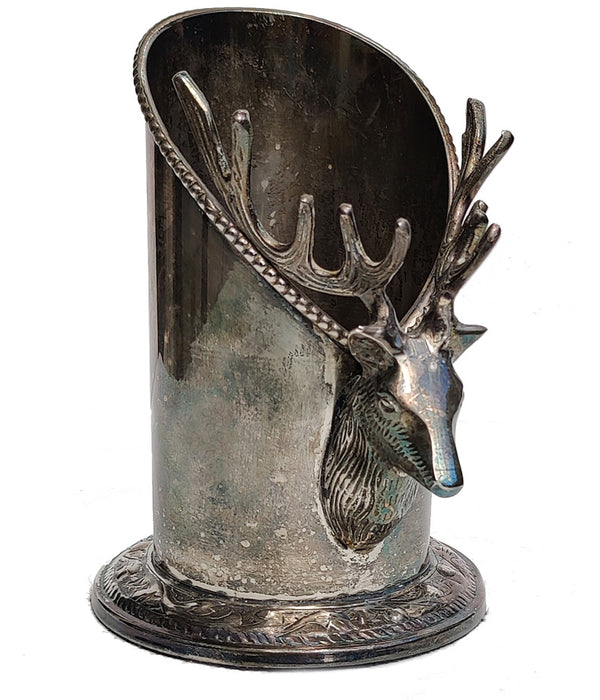 A silver vintage wine of champagne bottle holder with a stag head detail 