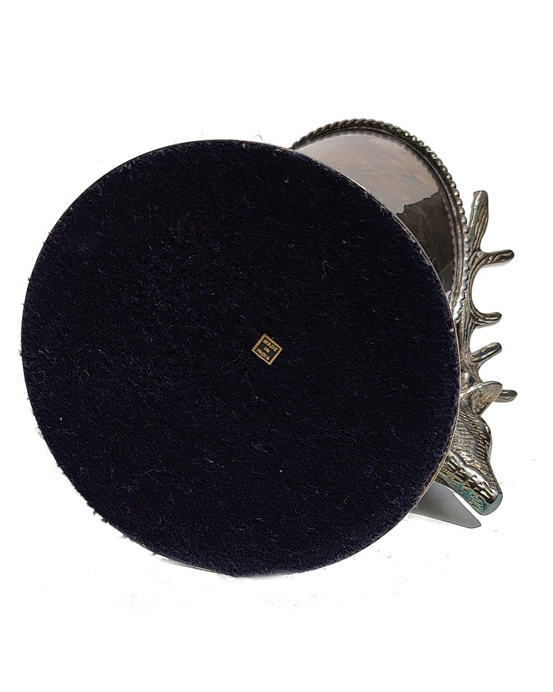 A silver vintage wine of champagne bottle holder with a stag head detail bottom