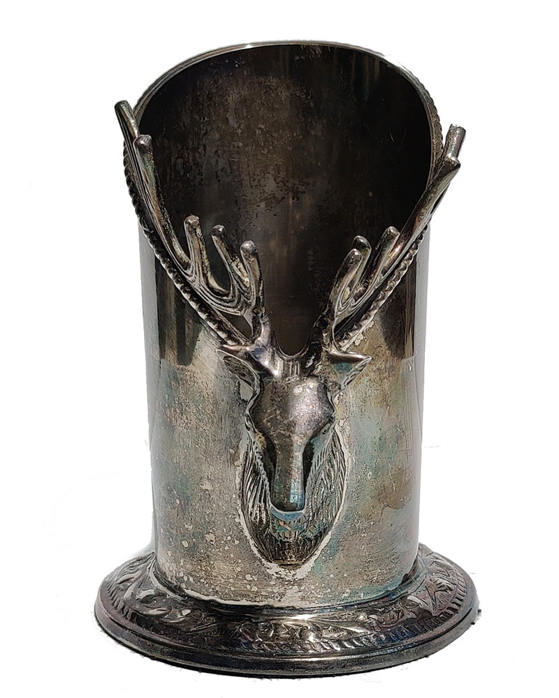 A silver vintage wine of champagne bottle holder with a stag head detail front view